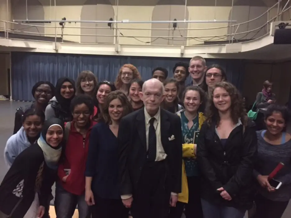 Photo of Mark Landis with a group of young people